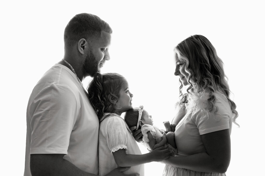 parents holding newborn during Central NJ newborn photography session